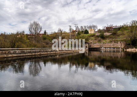 Scenic view of dam and reflections on the water. River Eresma Stock Photo