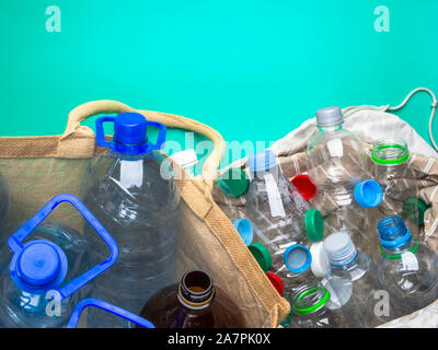 Transparent plastic bottles recycling in eco bag, recycle concept Stock Photo