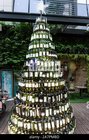 Christmas tree made from empty wine bottles Stock Photo