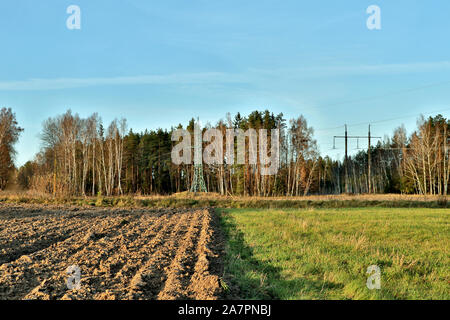 Countryside landscape of arable land field with selective focus. Autumn background with copy space