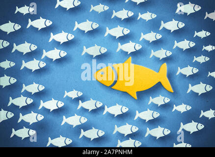 Yellow big fish swimming through the opposite direction. 3D illustration. Stock Photo