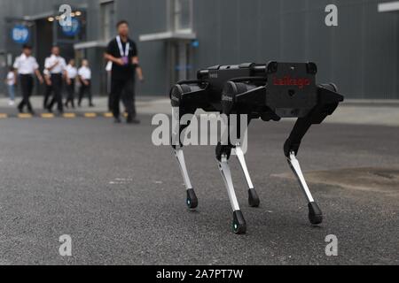 A four-legged robot dog called 'Laikago' developed by Unitree is displayed during the 2019 Word Robot Conference (WRC) in Beijing, China, 20 August 20 Stock Photo