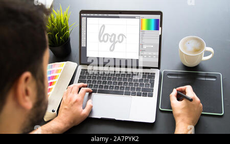 graphic designer working on laptop mock up Stock Photo