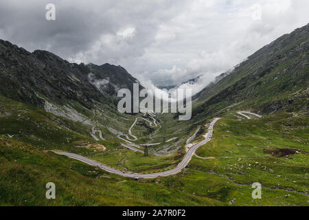 Endless road turns at the world famous mountain pass road Transfagarasan with clouds rolling in as seen during a Romania road trip (Romania, Europe) Stock Photo