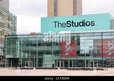 MANCHESTER, UK - APRIL 22, 2013: People visit Studios MediaCityUK in Manchester, UK. MediaCityUK is a 200-acre development completed in 2011, used by Stock Photo