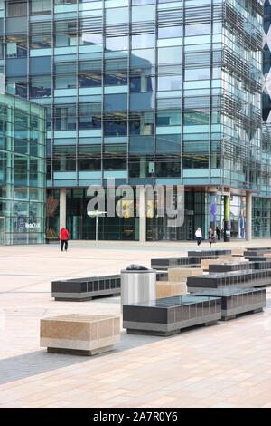 MANCHESTER, UK - APRIL 22, 2013: People visit the MediaCityUK in Salford, Manchester, UK. MediaCityUK is a 200-acre development completed in 2011, use Stock Photo