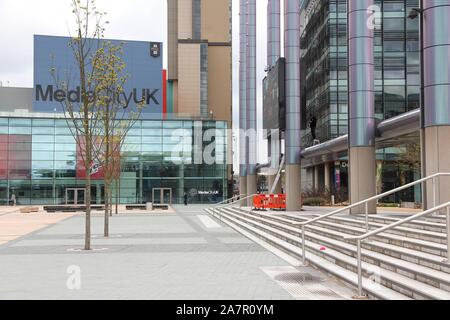 MANCHESTER, UK - APRIL 22, 2013: People visit the MediaCityUK in Salford, Manchester, UK. MediaCityUK is a 200-acre development completed in 2011, use Stock Photo