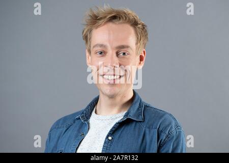 Dresden, Germany. 30th Oct, 2019. The actor Oliver Morschel stands in front of a photo wall in the boulevard theatre. The occasion is the presentation of the musical 'Frank Schöbel Story', which deals with the career of the GDR hit singer Frank Schöbel on stage. Credit: Sebastian Kahnert/dpa-Zentralbild/dpa/Alamy Live News Stock Photo