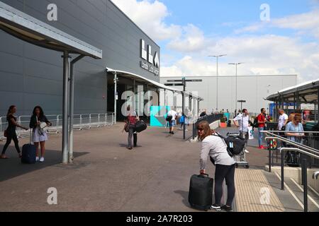 LUTON, UK - JULY 12, 2019: Passengers visit London Luton Airport in the UK. It is UK's 5th busiest airport with 16.5 million annual passengers. Stock Photo