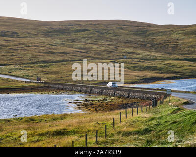 A car crosses the Bridge of Walls across Browland Voe in the west of Mainland in Shetland, Scotland, UK. Stock Photo