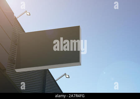 Blank black rectangular outdoor box mockup hanging on mall Stock Photo