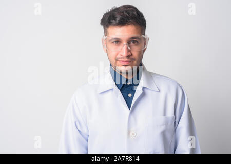 Face of young Persian man doctor as scientist Stock Photo