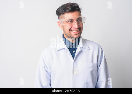 Face of happy Persian man doctor as scientist thinking Stock Photo