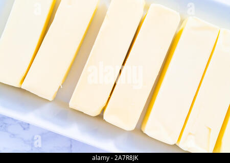 Organic sticks of butter at the room temperature. Stock Photo