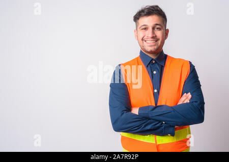 Portrait of happy Persian man construction worker smiling with arms crossed Stock Photo