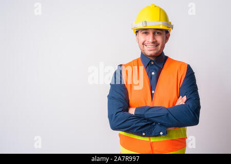 Portrait of happy Persian man construction worker smiling with arms crossed Stock Photo