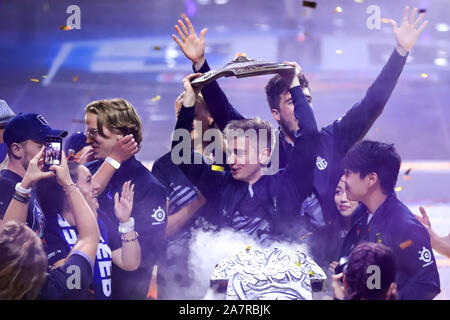 Players of Europe's OG pose for photos with their trophy after