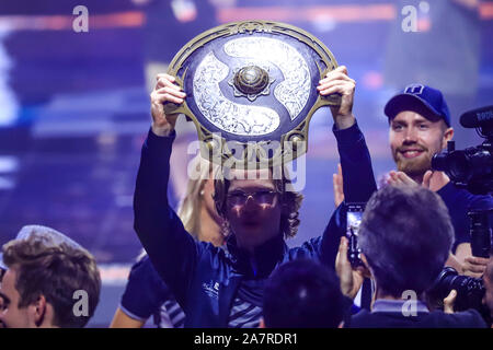 Players of Europe's OG pose for photos with their trophy after