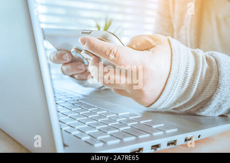 woman using laptop and smartphone, searching web, browsing information, Close up of business women working with typing on laptop empty at workplace.Se Stock Photo