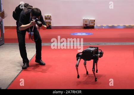 A four-legged robot dog called 'Laikago' developed by Unitree is displayed during the 2019 Word Robot Conference (WRC) in Beijing, China, 20 August 20 Stock Photo