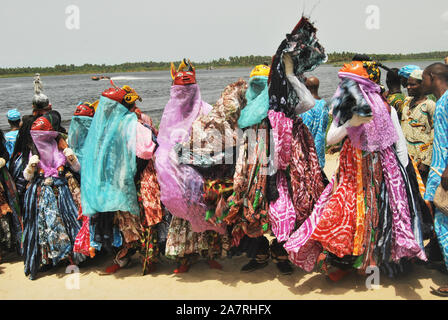 Men in Gelede Masks dancing to the beat of the spirit during the annual Lagos Black Heritage festival at the historical Slave Trade of Badagry Beach, Lagos Nigeria. Gelede Masquerades are being celebrated in South West Nigeria for ritual purposes and entertainment. Stock Photo