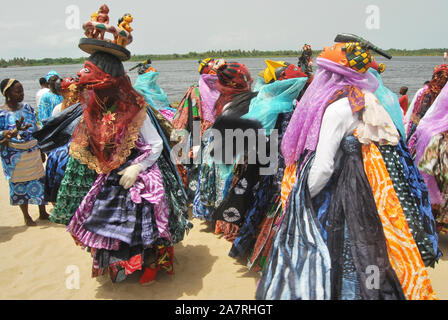 Men in Gelede Masks dancing to the beat of the spirit during the annual Lagos Black Heritage festival at the historical Slave Trade of Badagry Beach, Lagos Nigeria. Gelede Masquerades are being celebrated in South West Nigeria for ritual purposes and entertainment. Stock Photo