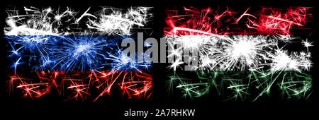 Russia, Russian vs Hungary, Hungarian New Year celebration sparkling fireworks flags concept background. Combination of two states flags. Stock Photo