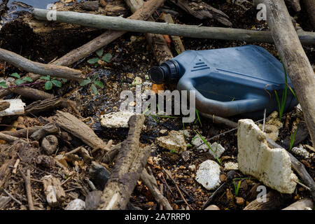 Styrofoam and plastic pollution garbage in water on beach. Stock Photo