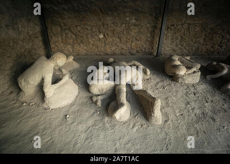 Pompei. Italy. Archaeological site of Pompeii. Orto dei Fuggiaschi / Garden of the Fugitives, plaster casts of bodies of people who died as they tried Stock Photo
