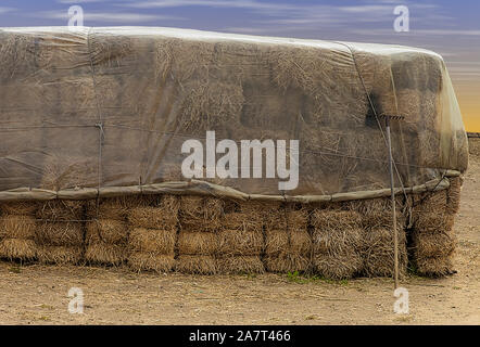 Ploughed by haystack Stock Photo - Alamy