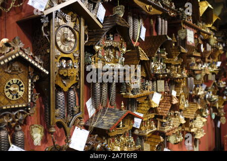 Wall display of Cuckoo clocks for sale on a Belgium shop Stock Photo