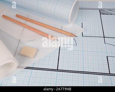 The projects of houses as a background, Architect workplace. Architectural project, blueprints, blueprint rolls on wooden desk table. Construction bac Stock Photo