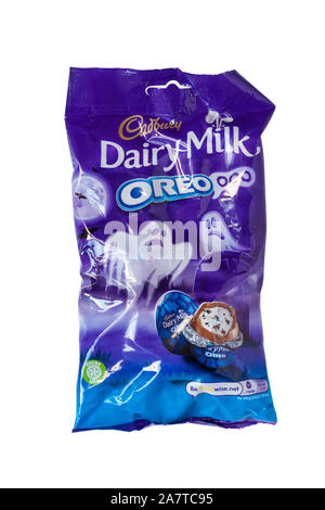 Bag of Cadbury Dairy Milk Oreo Oreoooo isolated on white background milk chocolate with vanilla flavour filling and biscuit pieces ready for Halloween Stock Photo