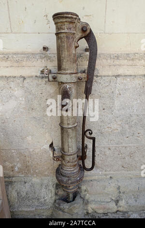 Chambord, France 30 July 2019: Old hand operated water pump in the grounds of Chateau de Chambord in France Stock Photo