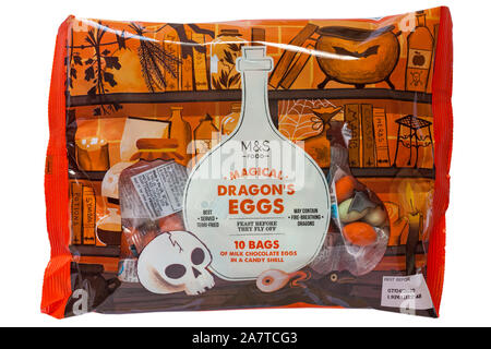Pack of M&S Magical Dragon's Eggs isolated on white background - ideal for Halloween - 10 bags of milk chocolate eggs in a candy shell Stock Photo