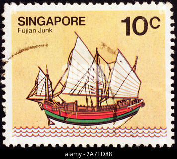 Traditional junk on postage stamp of Singapore Stock Photo