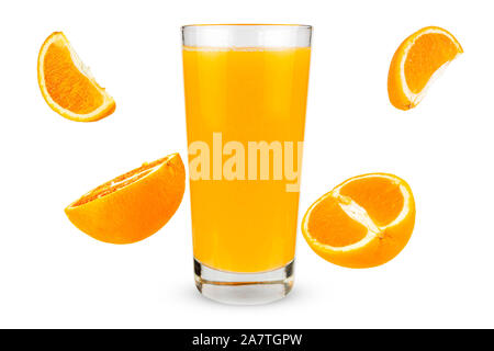 Glass of juice with falling oranges on white background Stock Photo