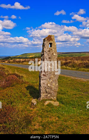 Ancient standing stone on the side of Wheeldale Roman Road on the North York Moors, Yorkshire, England, UK Stock Photo