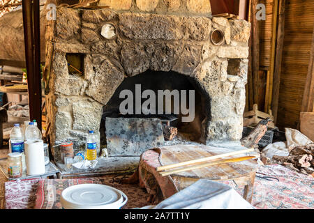 Rustic stone built wood burning oven in a small old restaurant in Turkey. Stock Photo