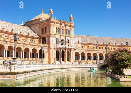 Rowing boat on the small canal through the Plaza de España Seville Maria Luisa Park Seville Spain seville Andalusia Spain EU Europe Stock Photo