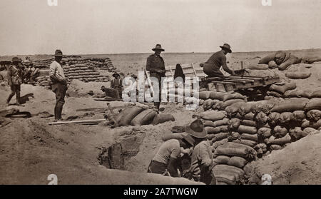 British artillerymen dig in to defend the Suez canal. The Raid on the Suez Canal took place between 26 January and 4 February 1915 when substantial Ottoman forces crossed the Sinai peninsula under German officers advanced from Southern Palestine to attack the British Empire-protected Suez Canal. Their attack failed - mainly because of strongly-held defences and alert defenders, but it marked the beginning of the Sinai and Palestine Campaign (1915-1918) of World War I. Stock Photo