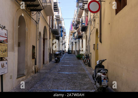 One of the many colourful narrow side streets in the town of Cefalú on the island of Sicily,Italy. Stock Photo