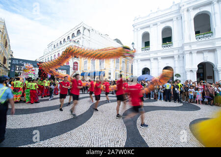 Performers take part in the dragon and lion dance parade as part of the Wushu Masters Challenge 2019 event in Macau, China, 4 August 2019.   About 350 Stock Photo
