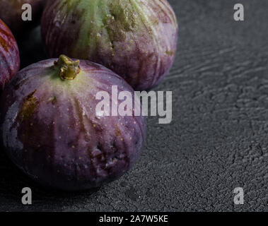 fresh figs close-up on black background. dark moody photo Stock Photo