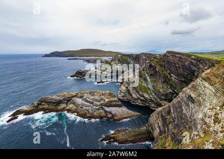 Kerry Cliffs offer spectacular views of the Skellig Islands and Puffin Island, over 305 meters high. Stock Photo