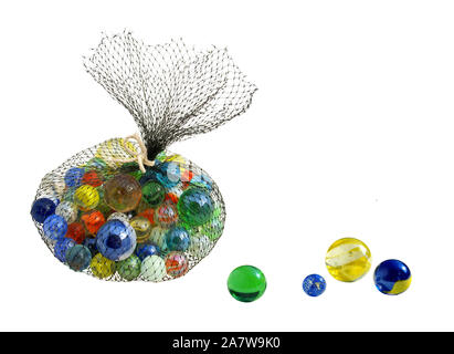 Bag of marbles and beads isolated on white background Stock Photo