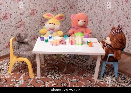 Table with different baby accessories in children room Stock Photo