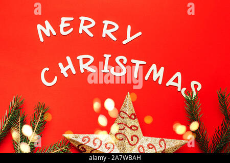 words of Merry christmas on red background. Stock Photo