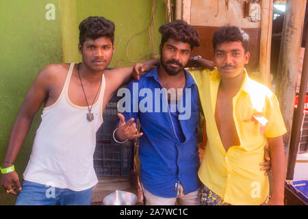 Portrait of young men posing while standing in market, Trichy, Tamil Nadu, India Stock Photo