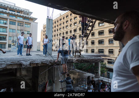 Beirut, Lebanon. 3rd Nov, 2019. Protesters walk about the defunct theater in central Beirut, Lebanon on the 18th day of protests, Sunday November 3, 2019. Prime Minister Saad Hariri resigned on Wednesday October 30, 2019 in the face of nationwide protests. Credit: Sima Diab/ZUMA Wire/Alamy Live News Stock Photo